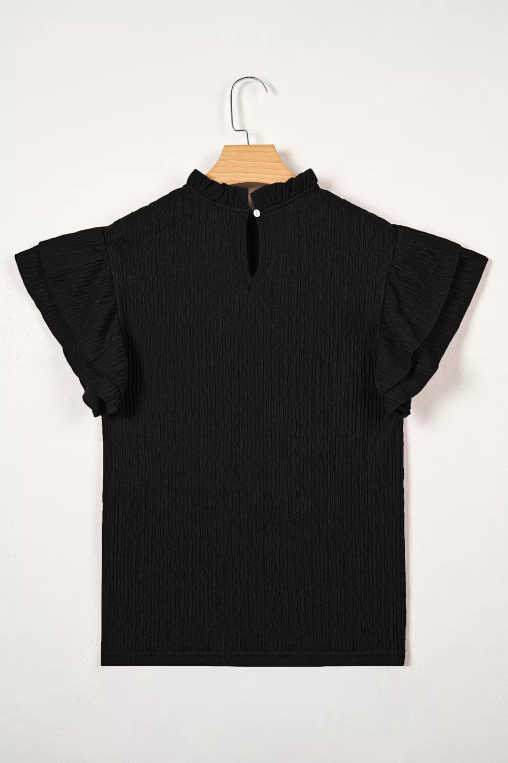Black textured maternity shirt with ruffled mock neck and flutter sleeves