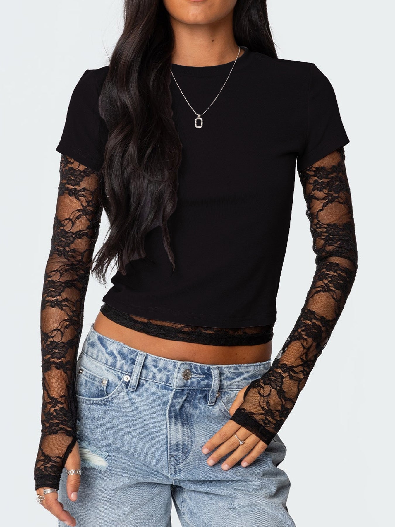 Black fitted t-shirt with lace sleeves and crew neck, cropped length.