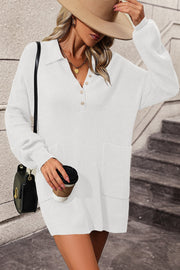 White collared knit tunic with button detail and front pockets, long sleeves.