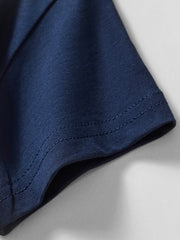 Navy blue cotton t-shirt sleeve hem with double-stitched detail.