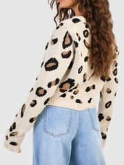 Leopard print acrylic cardigan with long sleeves and crew neck.