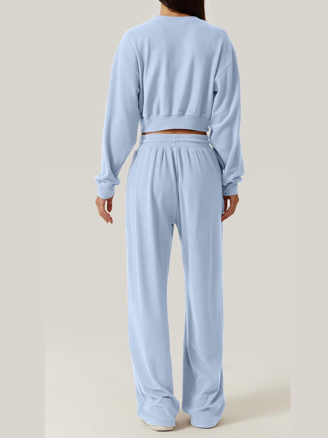 Light blue knit lounge set with cropped sweatshirt and wide-leg pants