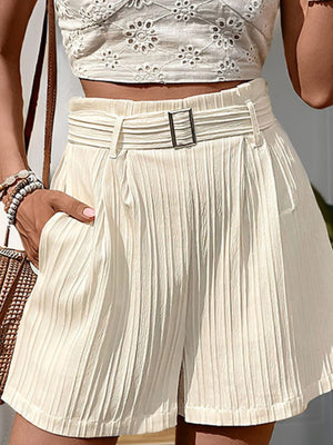 Beige pleated texture belted shorts with a relaxed fit and side pockets.