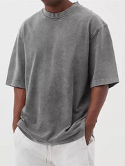 Men's grey vintage wash oversized cotton crew neck t-shirt with distressed details.