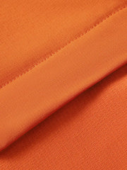 Orange long sleeve tee showing textured fabric and stitched seam detail
