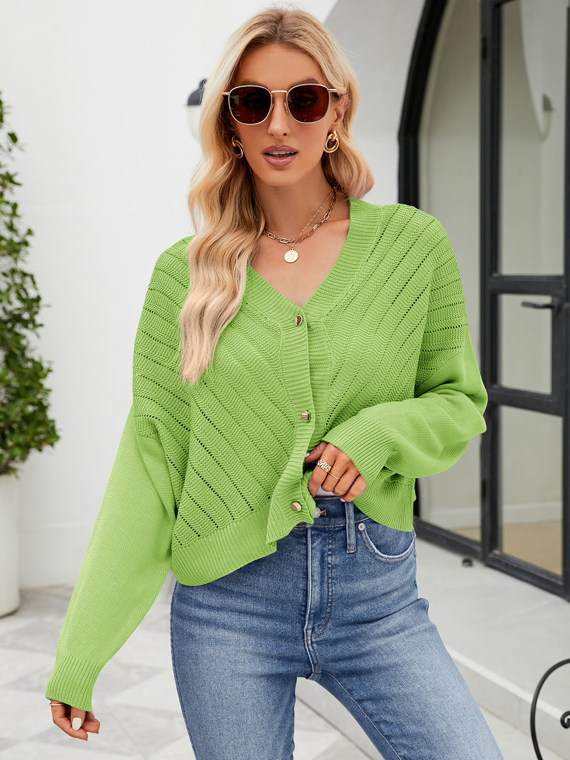 Cropped lime green V-neck knit cardigan with button front and open knit details