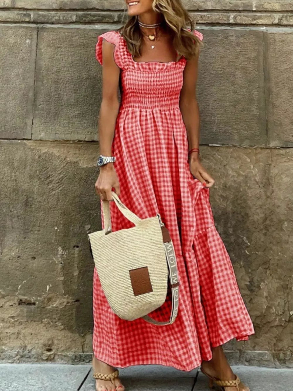 Red gingham ruffled maxi maternity dress with square neckline and smocked bodice.