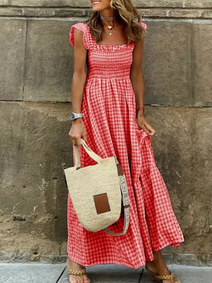 Red gingham ruffled maxi maternity dress with square neckline and smocked bodice.