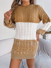 Colorblock cable knit mini dress in camel and white acrylic with crew neck and long sleeves.