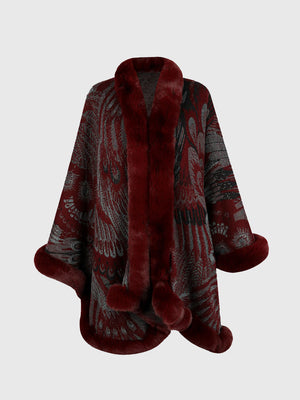 Wine feather print acrylic cape with faux fur trim and pom poms.