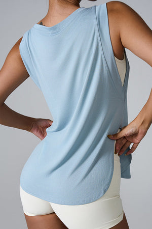 Blue performance tank top with asymmetric hemline and relaxed fit.