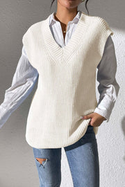 Ivory textured knit V-neck sleeveless top styled with a white shirt and jeans.