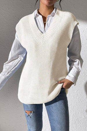 Ivory textured knit V-neck sleeveless top styled with a white shirt and jeans.