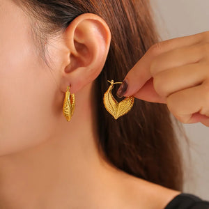 Textured gold leaf hoop earrings with 18K gold plating.