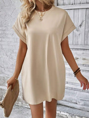 Relaxed tee dress in tan with cuffed short sleeves and a crew neck.