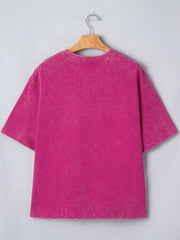 Pink acid wash cotton t-shirt with crew neck and short sleeves.