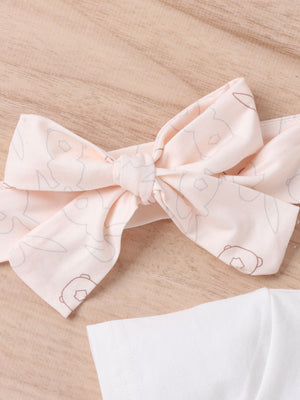 Baby headband with bunny print and bow detail, paired with a white t-shirt.