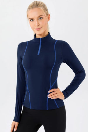 Dark blue athleisure zip-neck long sleeve top with contrast seam details.