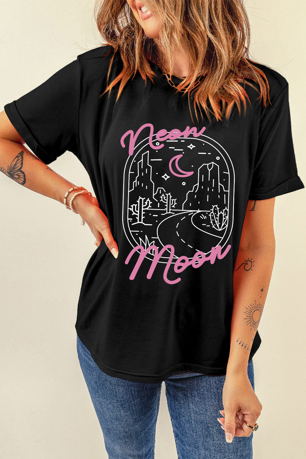 Black t-shirt with desert neon graphic and pink text.