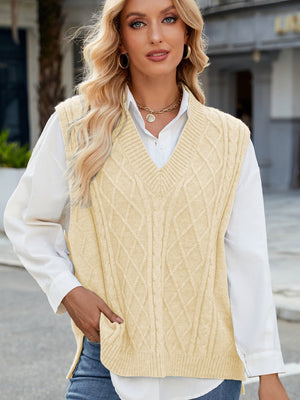Cable knit V-neck sweater vest in tan with diamond pattern.