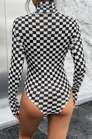 Checkerboard mesh turtleneck bodysuit with long sleeves in black and white.
