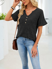 Black ribbed knit short sleeve t-shirt with V-neck and decorative buttons.