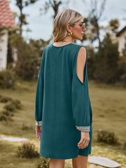Teal cold shoulder mini dress with lace trim on sleeves.