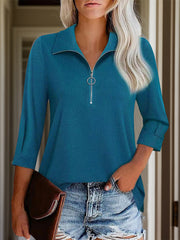 Peacock blue textured polo top with zip front and rolled sleeves