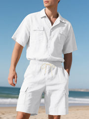 White relaxed-fit button-up shirt with two chest pockets and drawstring cargo shorts.