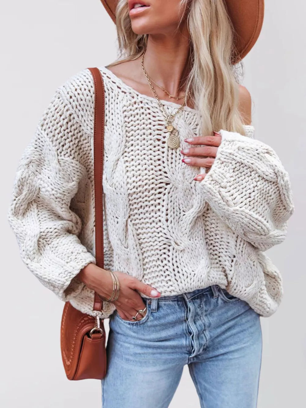 cream pullover sweater with cable knit and round neck