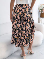 Black floral midi skirt with ruffle hem and drawstring waist.