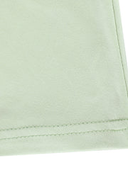Light green ruffled mermaid maxi dress detail showing hem stitching