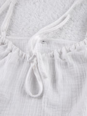 White cotton cami pajama top with adjustable tie detail and spaghetti straps