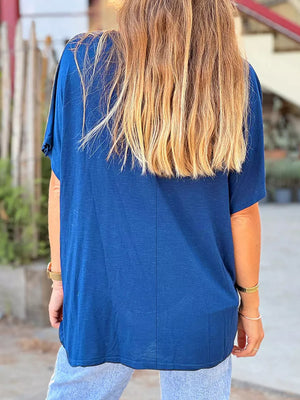 Blue polyester relaxed fit tee with short sleeves and a V-neck, shown from the back.