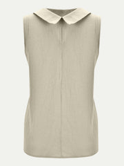 Sleeveless beige blouse with Peter Pan collar and textured fabric
