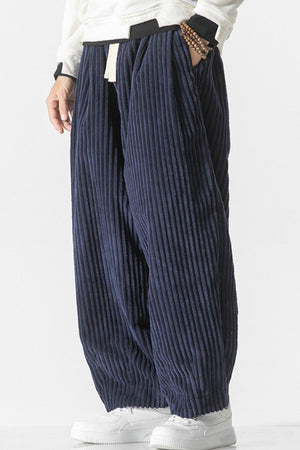 Navy corduroy wide-leg cargo pants with a relaxed fit and drawstring waist.