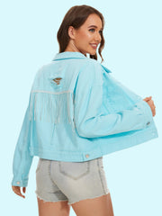 Aqua distressed denim trucker jacket with crystal fringe detail and back rips.