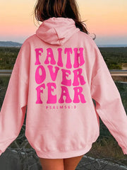 Pink graphic hoodie with "FAITH OVER FEAR" and "PSALM 56:3" text on back.