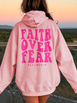 Pink graphic hoodie with "FAITH OVER FEAR" and "PSALM 56:3" text on back.