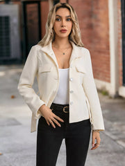 Belted button-up trench coat in beige with flap pockets and silver buttons.