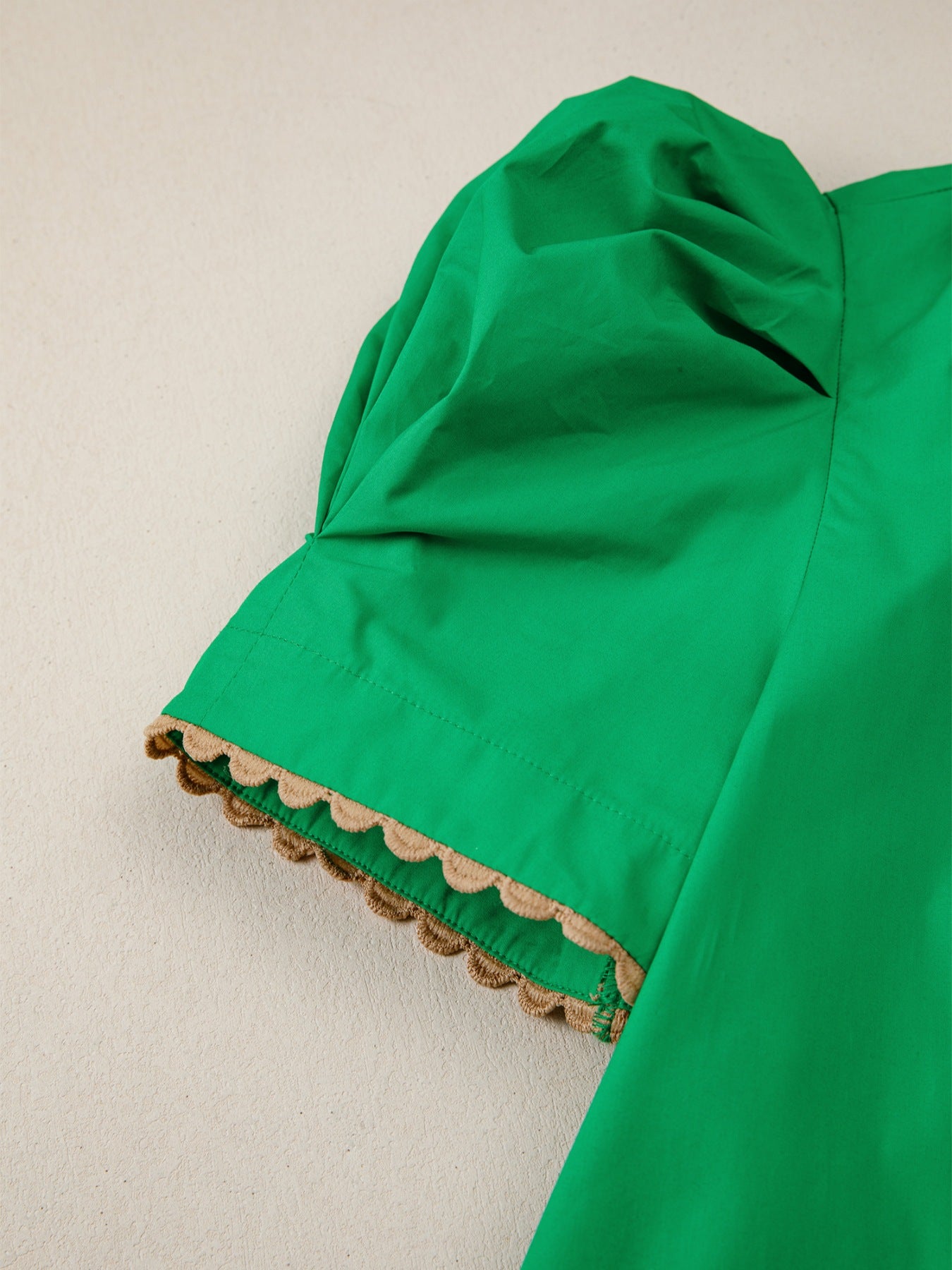 Green cotton blouse with puff sleeves and ricrac trim detail