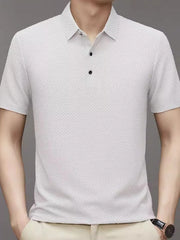 White textured knit polo shirt with a classic collar and two-button placket.
