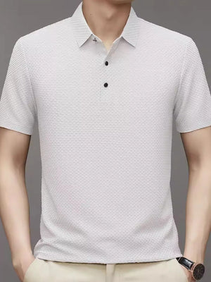 White textured knit polo shirt with a classic collar and two-button placket.