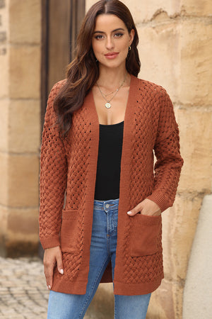 Textured open-knit pocket cardigan in caramel acrylic with open front and long sleeves.