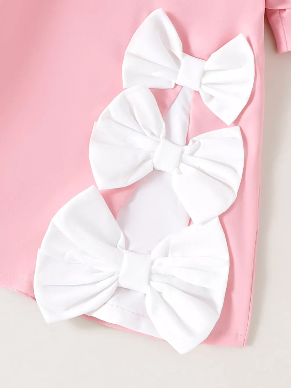 Children's Bow Puff Sleeve Dress in Pink, close-up detail