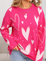 Heartfelt Fuchsia Knit Sweater with allover heart print, crew neck, and long sleeves.