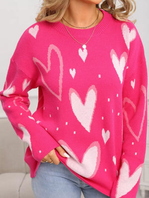 Heartfelt Fuchsia Knit Sweater with allover heart print, crew neck, and long sleeves.