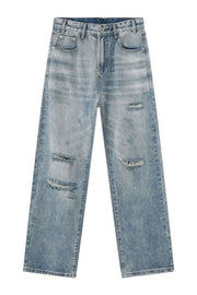 Baggy ripped denim jeans in medium wash with distressed details.