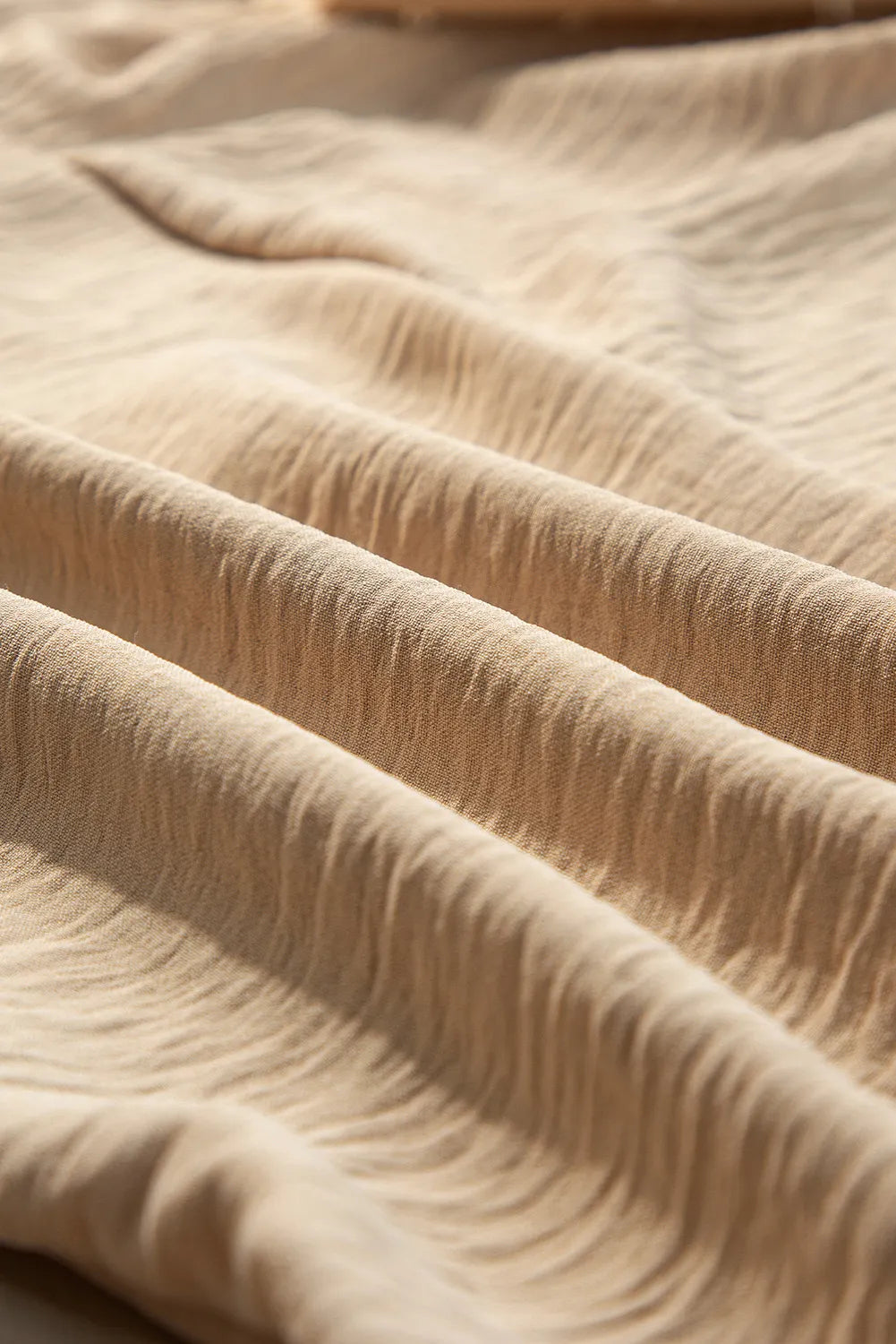 Tan textured blouson blouse with crinkled fabric detail