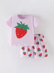 Girls' pink cotton pajama set with strawberry graphic and allover strawberry print.